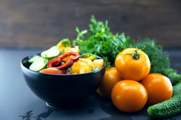 Close Up of colorful salad from tomatoes, cucumbers, peppers 