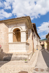 Fototapeta na wymiar Norcia, Italy. Tempetto (Small Temple,1354) on Umberto Street