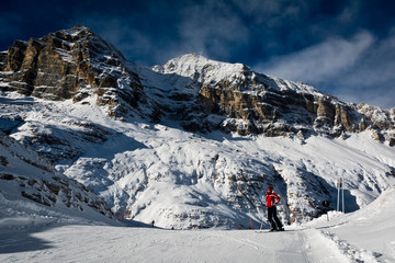 Naklejka na ściany i meble skier in red equipment in the Alps