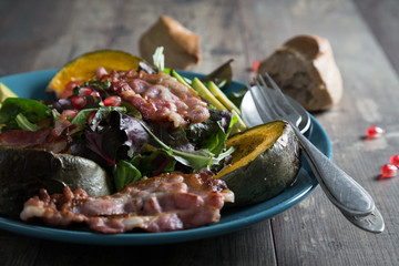 Vegetable salad with baked pumpkin and bacon