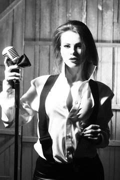 retro woman singing into microphone