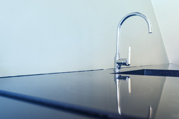 abstract sink for clean dish and mirror on table with light blue