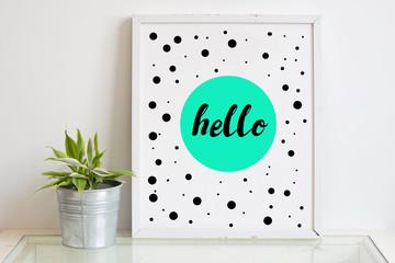 Note frame on the wall with quote HELLO