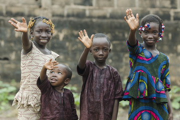 African Children Waving Hello and Goodbye!