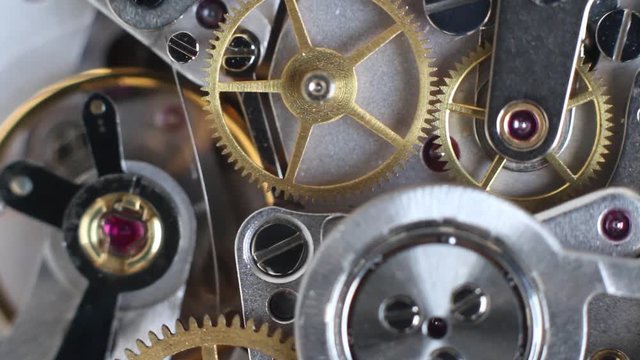 Top view of a clock mechanism working, watch gears background, vintage technology, precision device concept, macro hd