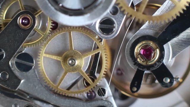 Top view of a clock mechanism working, watch gears background, vintage technology, precision device concept, macro hd