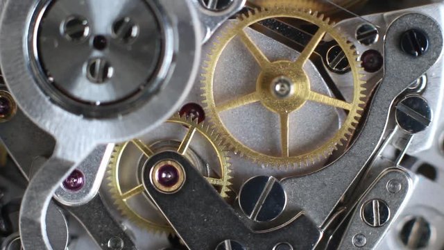 Top view of a clock mechanism working, watch gears background, vintage technology, precision device concept, macro hd