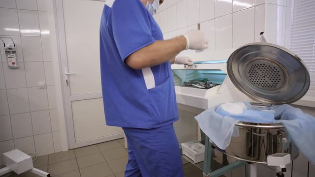 Doctor is preparing the tools for surgery