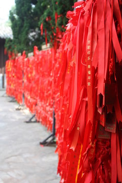 Red ribbons with Golden hieroglyphs in the Buddhist Nanshan centre on Hainan island in China