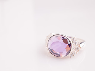 Jewel gemstone ring on white shine table