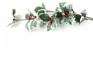 Artificial holly branch -  ilex aquifolium, with fruits, glass stones and glitter isolated on white...