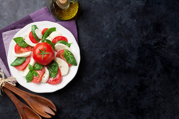 Caprese salad. Mozzarella, tomatoes and basil