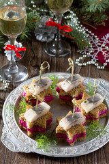 Holiday appetizer: Canapes in the form of a star with pickled he