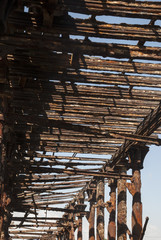 Old rusty pier in Guatemala shot in a cloudy morning. Champerico