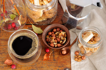 Still life with coffee, nuts and small apples