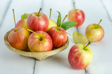 Red and yellow apple   on wooden background