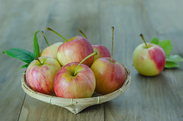 Red and yellow apple   on wooden background
