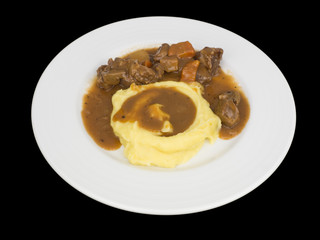 Beef stew with mashed potatoes isolated on the black background with clipping path