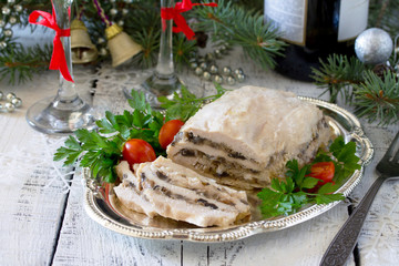 Homemade meat chicken roll with mushrooms, onions and gelatin on