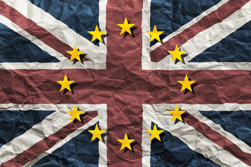 Brexit, flags of the United Kingdom and the European Union combined on crumpled paper background. Referendum 2016