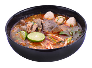 Noodles in Thai spicy tom yum soup with pork