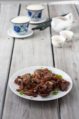 Spicy cumin lamb - traditional Uyghur dish  from Xinjiang region in China. 