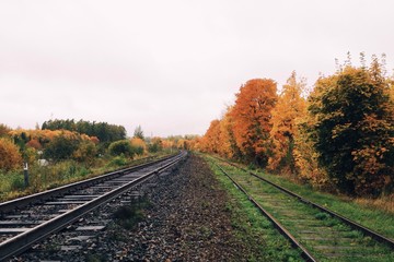 Obraz premium Railway landscape in autumn colors