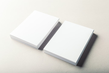 blank business cards on grey background