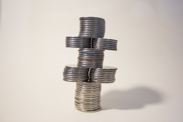 silver coins stacked isolated on a white background