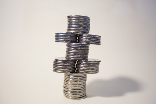 silver coins stacked isolated on a white background