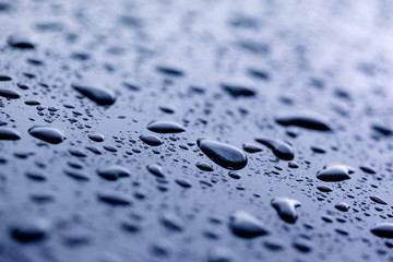 Close-up of Raindrops on Blue Metal