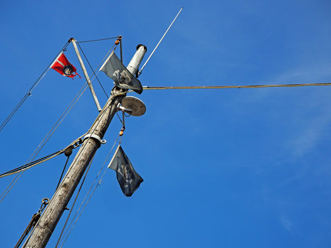 Low-Angle View Of Mast With Pirate Flag