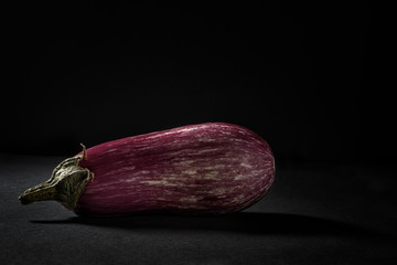 Zebra eggplant on black background