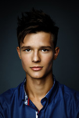 Obraz premium Handsome young man wearing shirt, portrait shot in studio