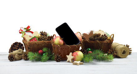 Christmas arrangement in a rustic style. Smartphone and festive