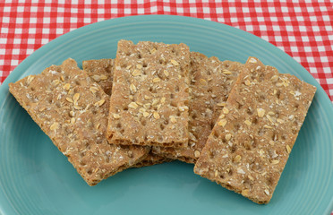 Multi grain whole grain crispbread crackers on blue plate
