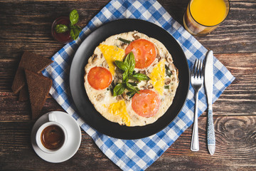 Omelet with tomatoes, parsley and feta cheese