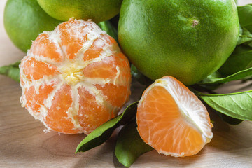 Peeled and unpeeled tangerines