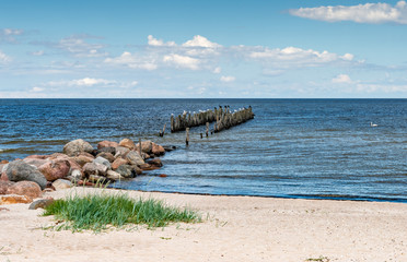 Old broken marine pier at harbor of Riga, Baltic Sea, Europe