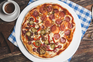 Delicious fresh pizza served on wooden table