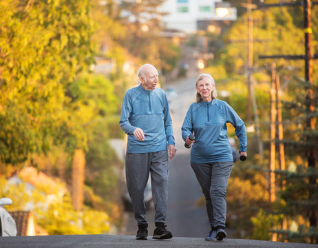 Happy Couple Walking On Street