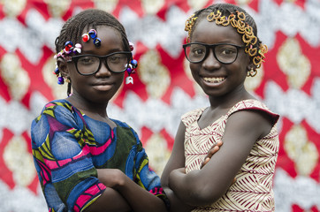 Two Proud African Girls Posing in front of the Camera Smiling and Laughing