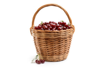 Basket full of fresh red cherry on a white background