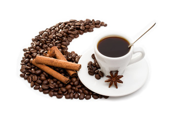 cup of coffee with cinnamon sticks, anise and chocolate