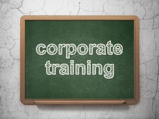 Fototapeta premium Learning concept: Corporate Training on chalkboard background
