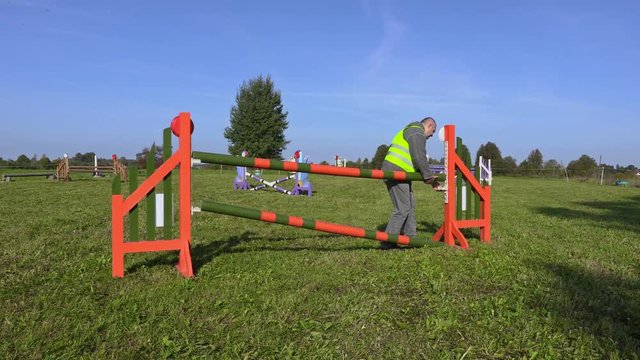 Horse handler arranged hurdle