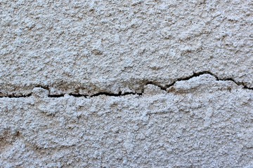 Old concrete textured background. Little scratches and cracks on the wall surface.