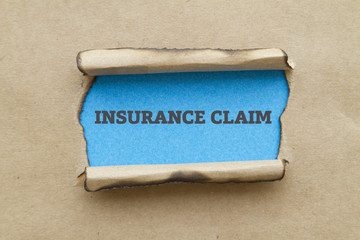 INSURANCE CLAIM written under torn paper.