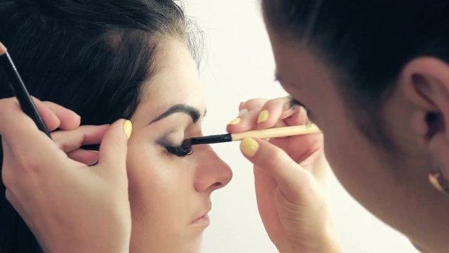 Make-up artist applying makeup