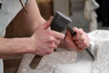hands of a sculptor in motion